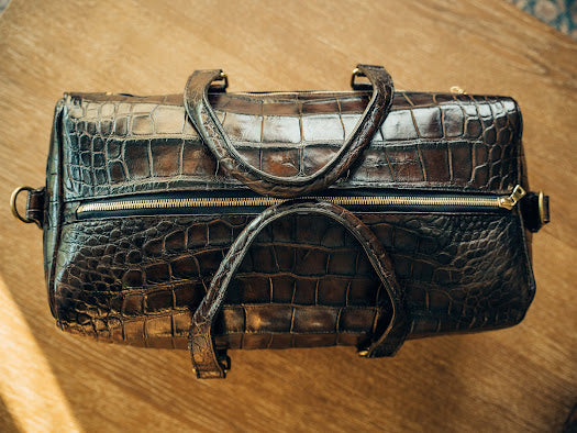 Crocodile duffle bag best sale